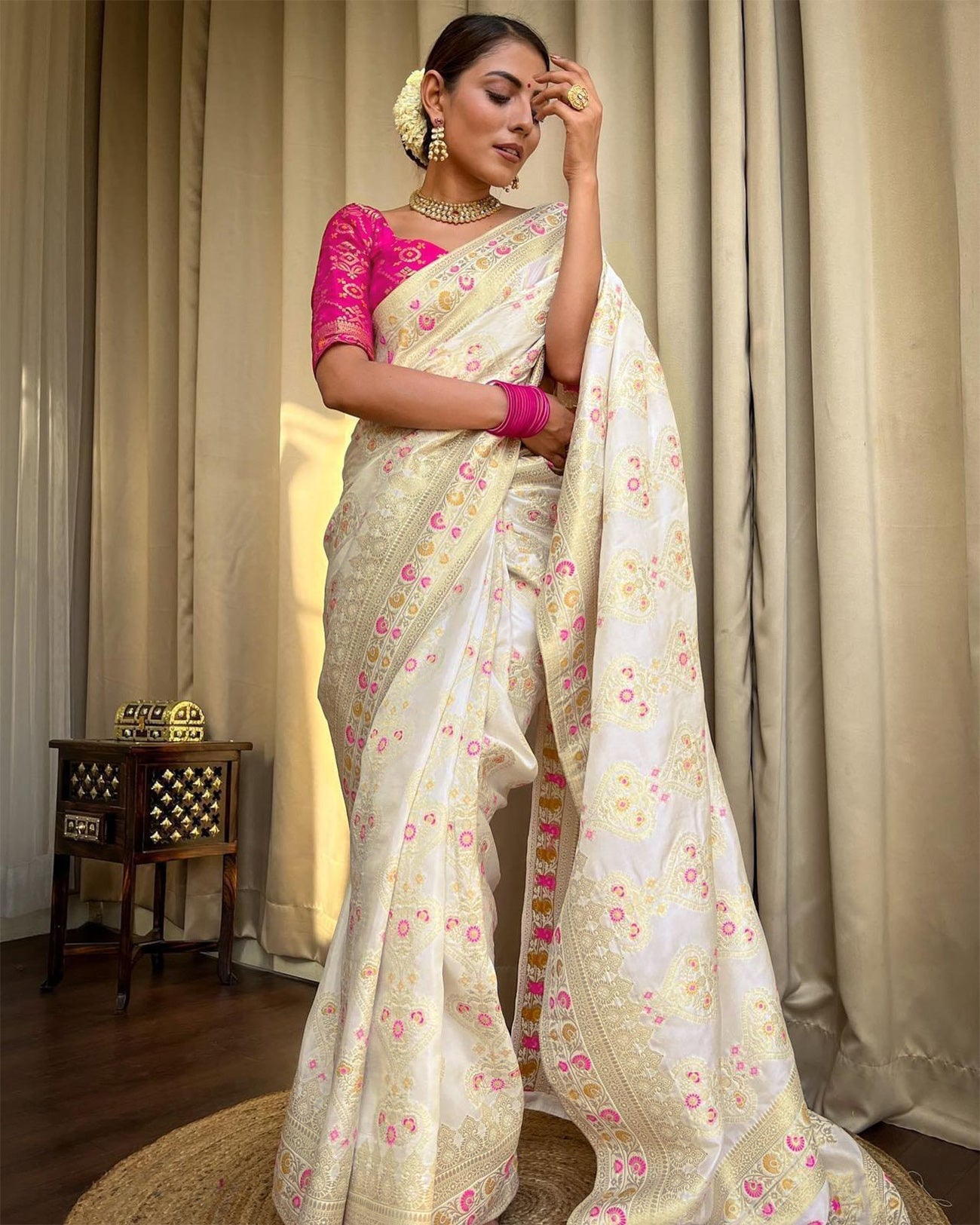 Elegant White Banarasi Silk Saree with Pink Floral Motifs and Golden Zari Work – Paired with Contrast Pink Blouse