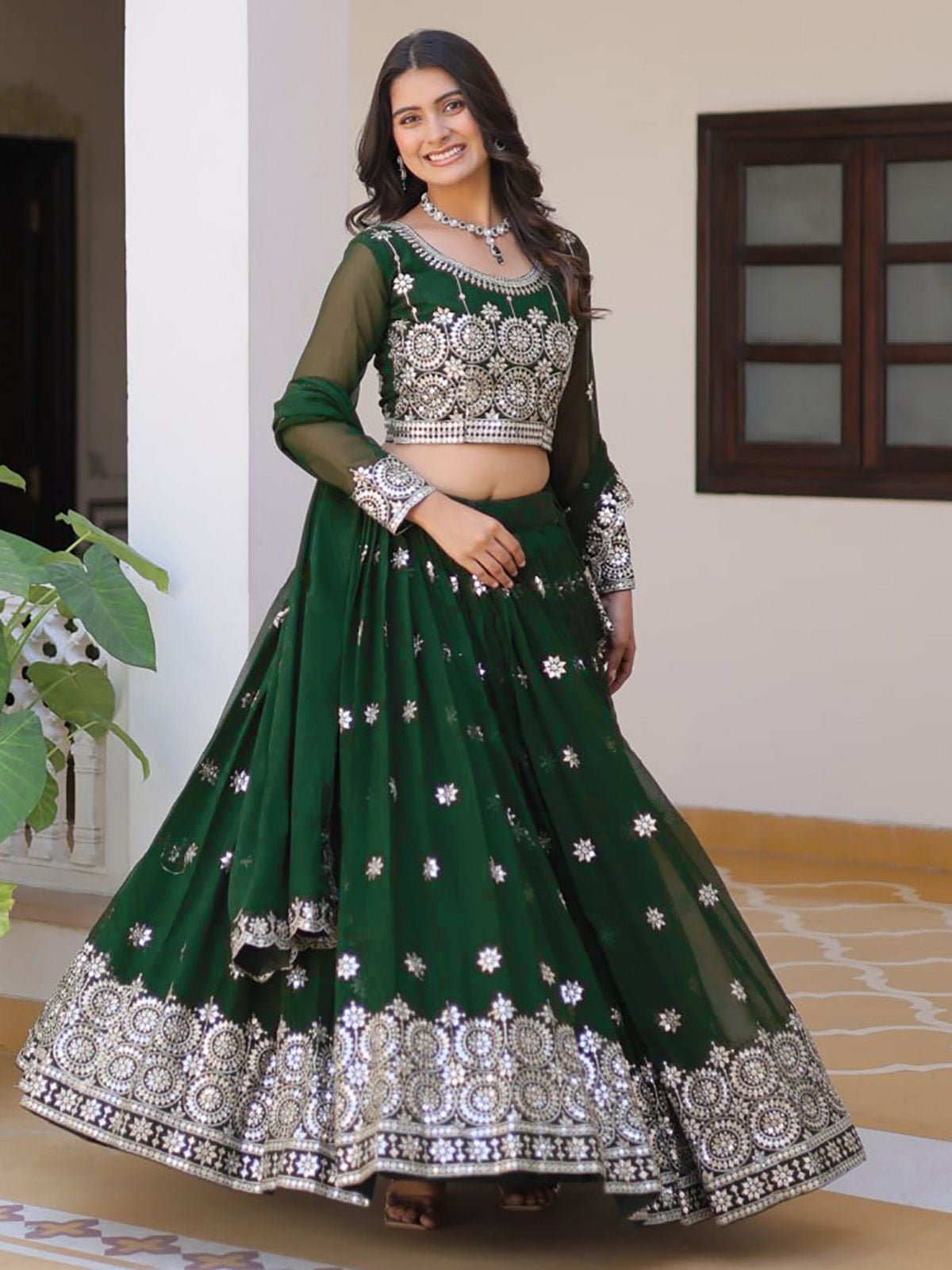 Emerald Green Embroidered Georgette Lehenga Choli with Mirror Work and Net Dupatta