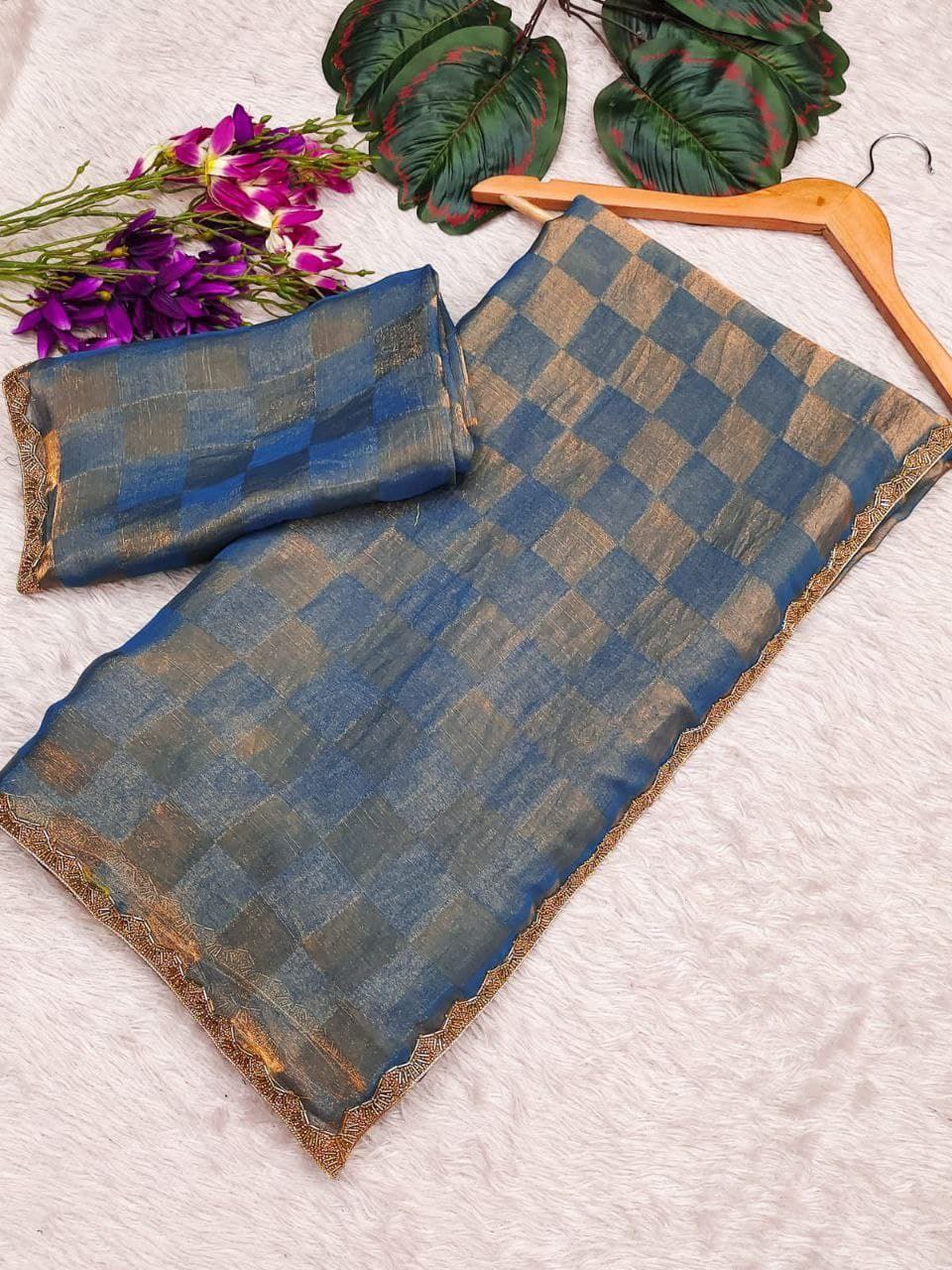 be an enthralling beauty of the evening by adorning this stunning sequined saree and blous