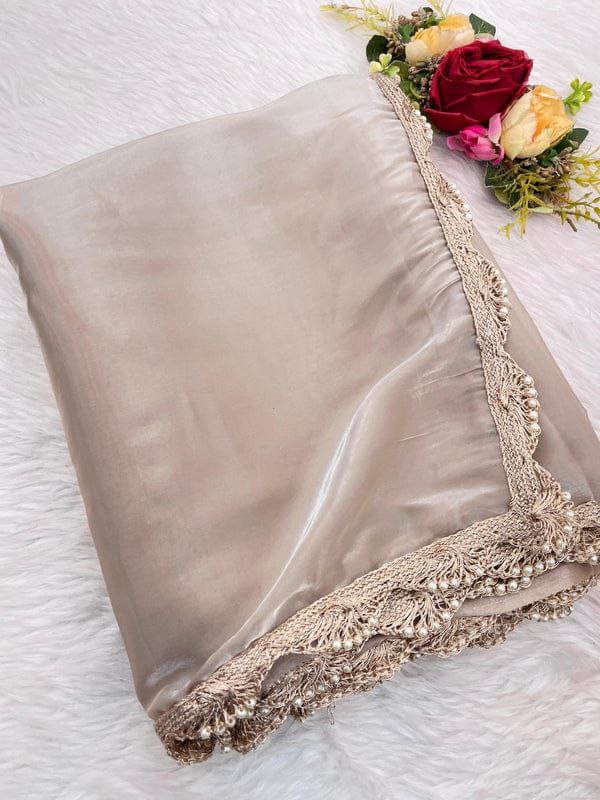 Jimichu fabric saree, featuring a solid design accentuated by a delicate Pearl Dori lace border