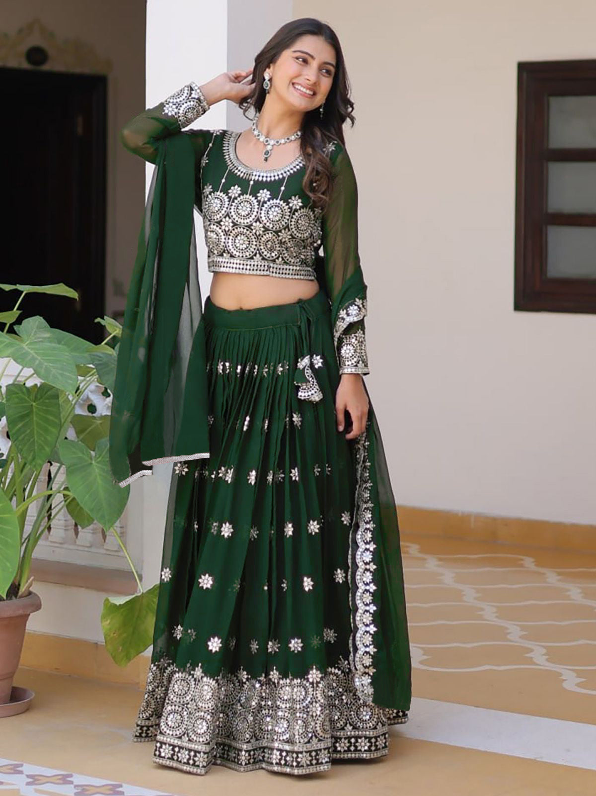 Emerald Green Embroidered Georgette Lehenga Choli with Mirror Work and Net Dupatta